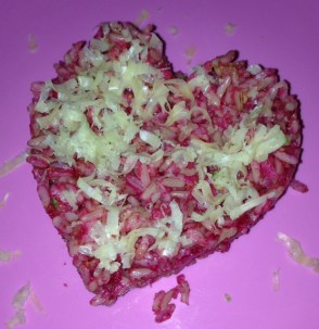 pink brown rice and zucchini heart with nut paste and sprinkle cheese